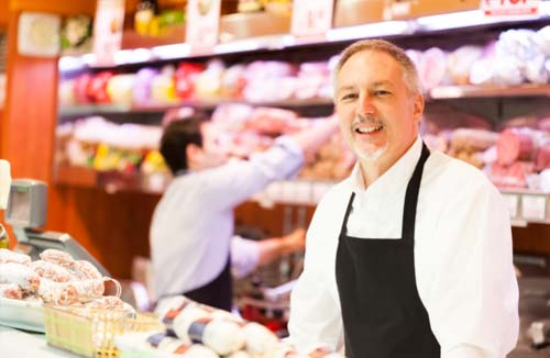 small business owner behind the counter