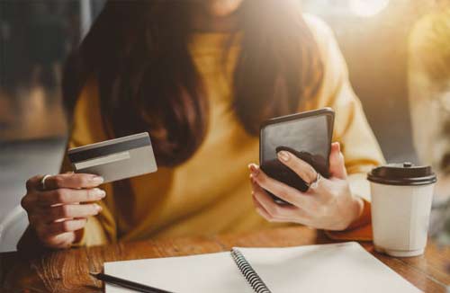 business woman holding a credit card