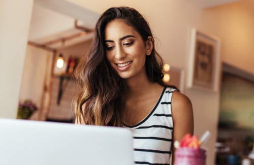 woman looking at her laptop