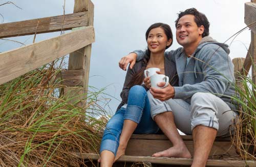 Couple on the beach sand dunes