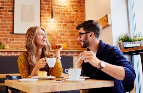 two friends having coffee in a cafe