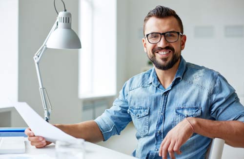 man sitting at his desk