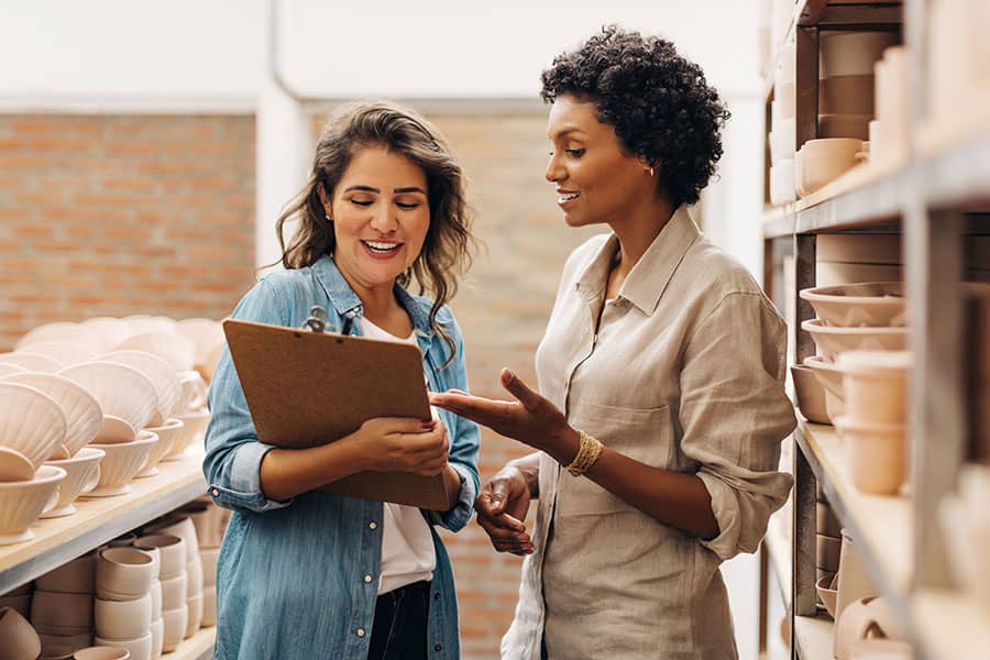 Two women employees talking