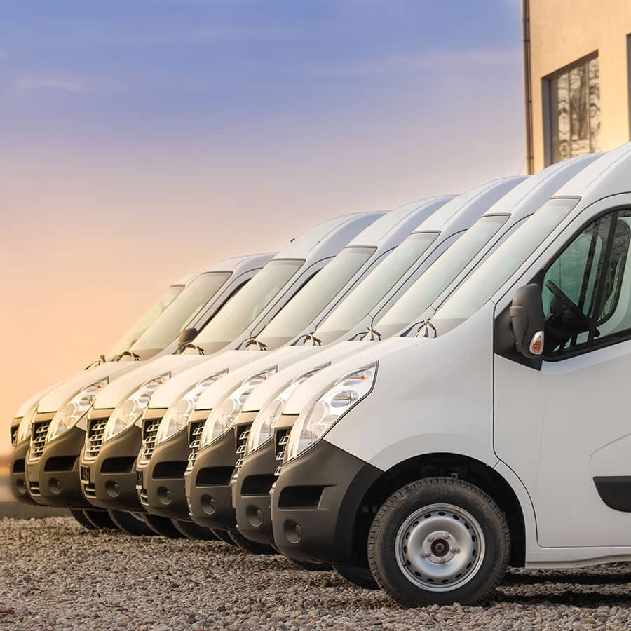 A row of new delivery vans for sale