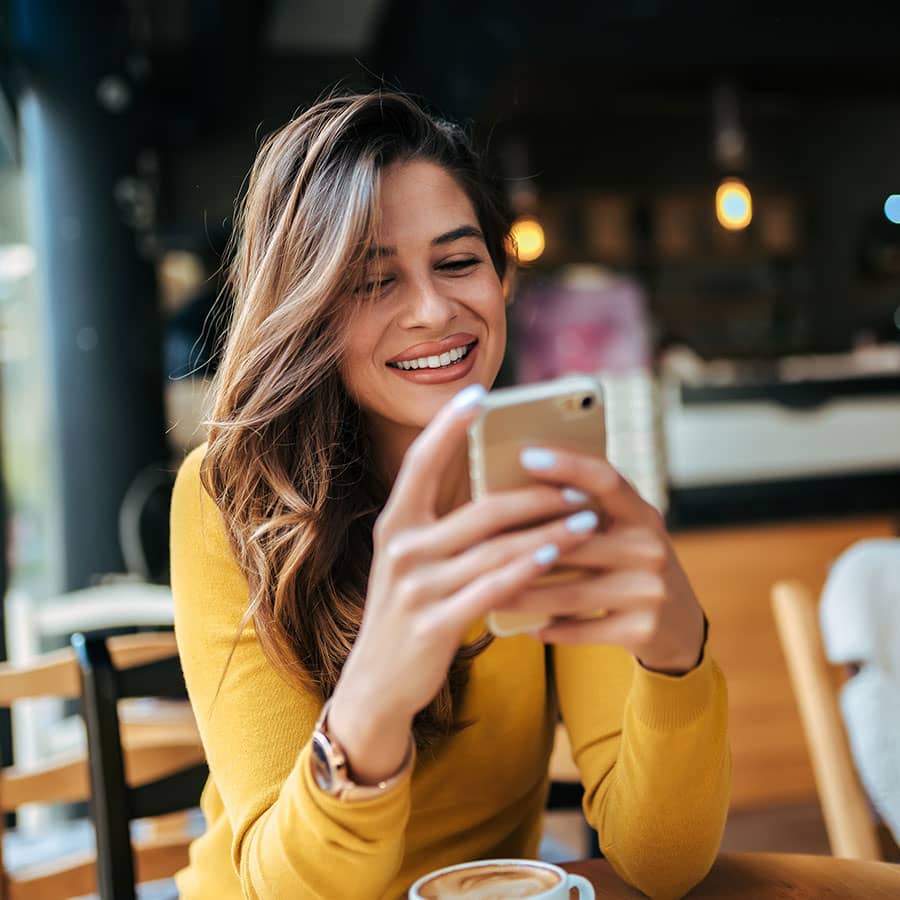 A woman looking at her mobile phone