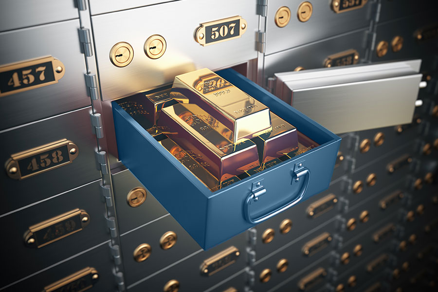 A safe deposit box with valuables spilling out