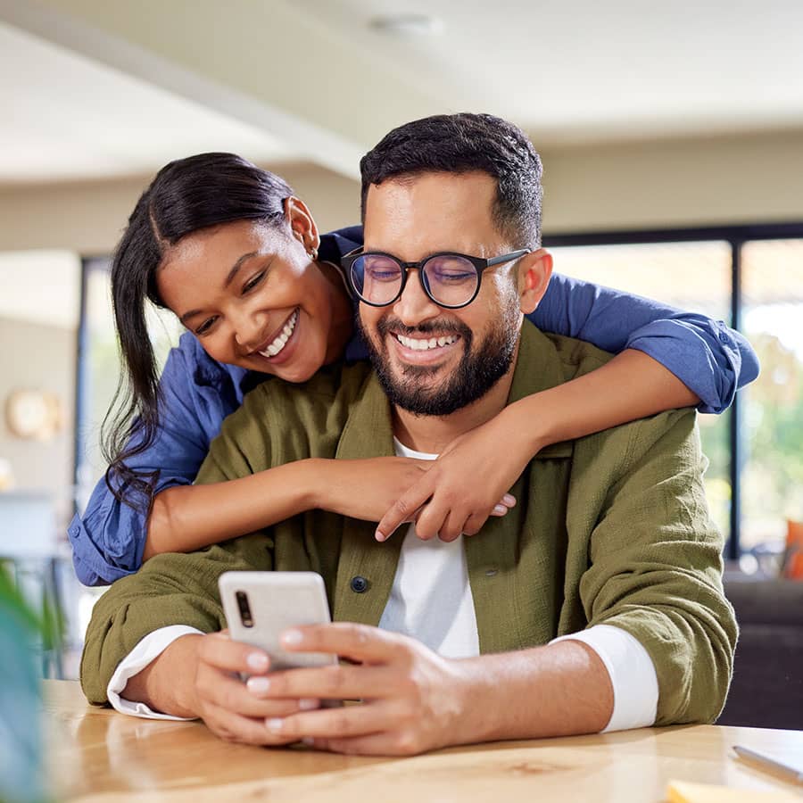 A couple looking at a mobile phone