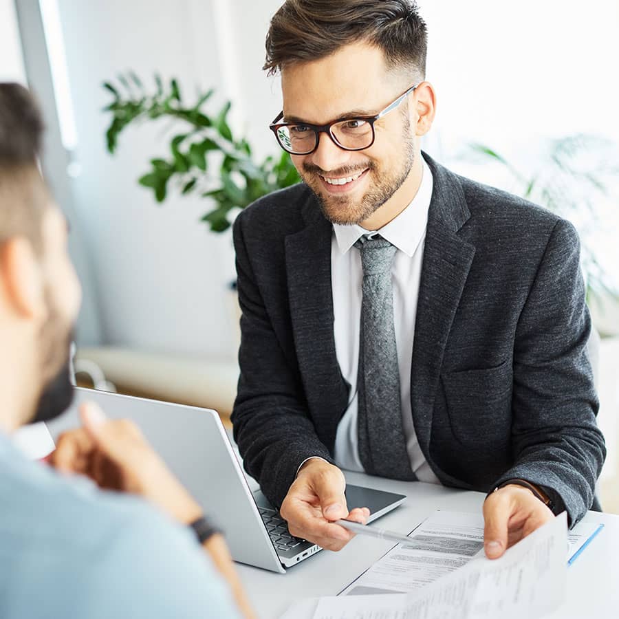 A wealth management professional discusses options with a client