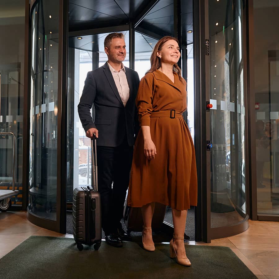 A couple walking into a hotel lobby